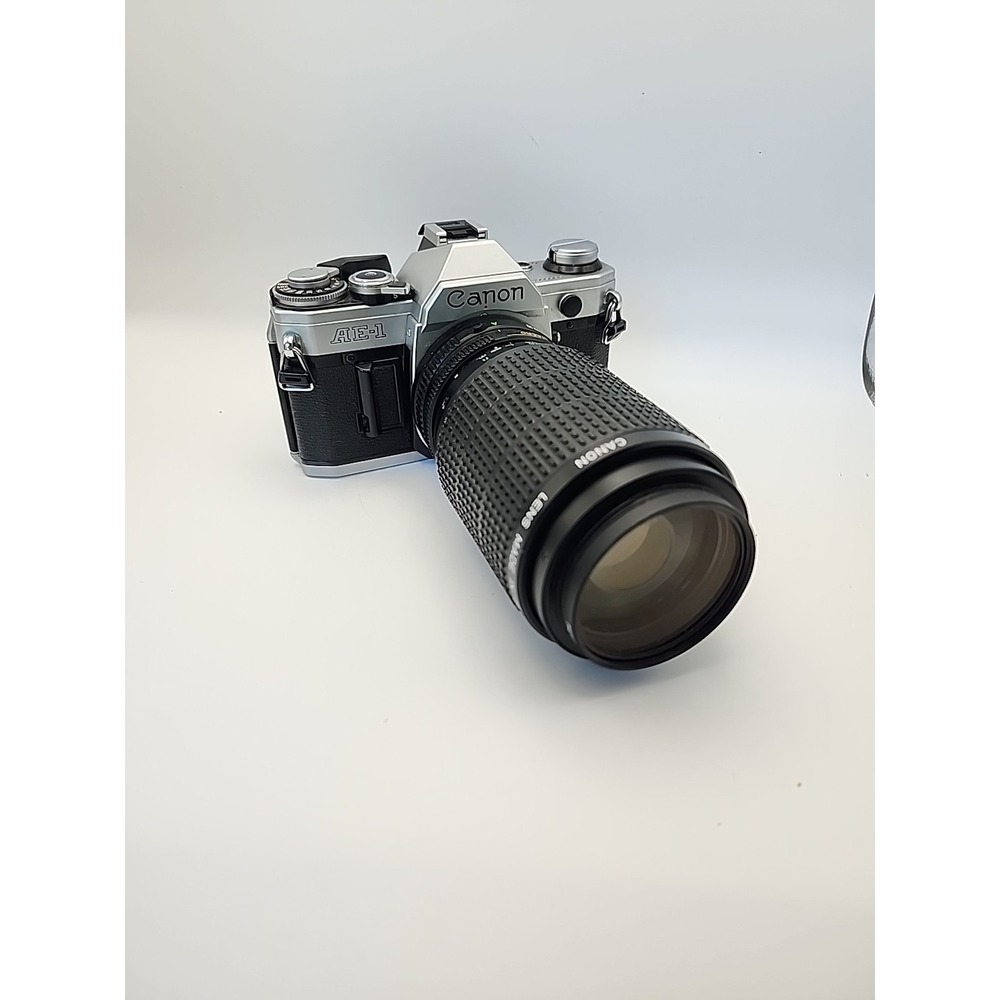 Canon AE-1 35mm SLR Film Camera With A Canon FD 75-200 1: 4.5 Lens Works Great